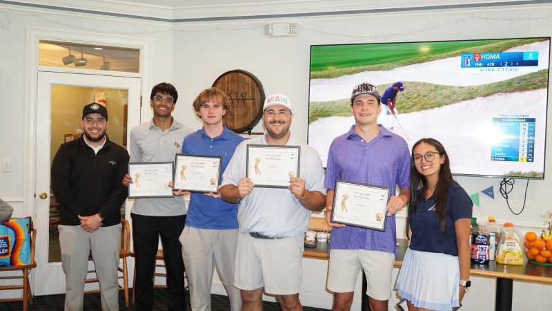 Christian and teammates holding 1st place certificates